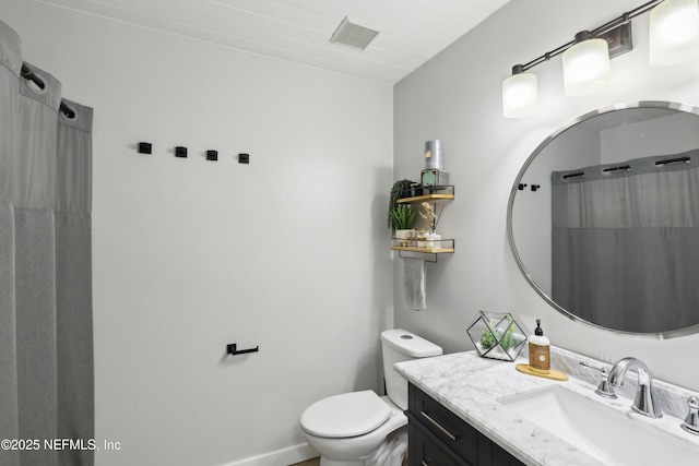 full bath with vanity, toilet, and visible vents