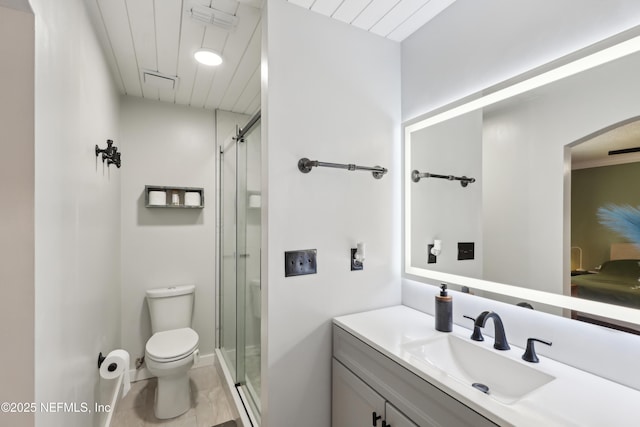 full bathroom with a shower stall, toilet, and vanity