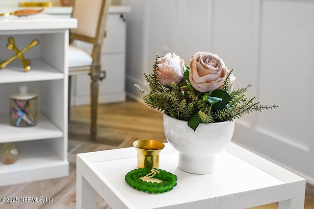 room details featuring baseboards and wood finished floors