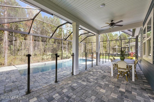 view of pool featuring a lanai, a patio area, a fenced in pool, and ceiling fan