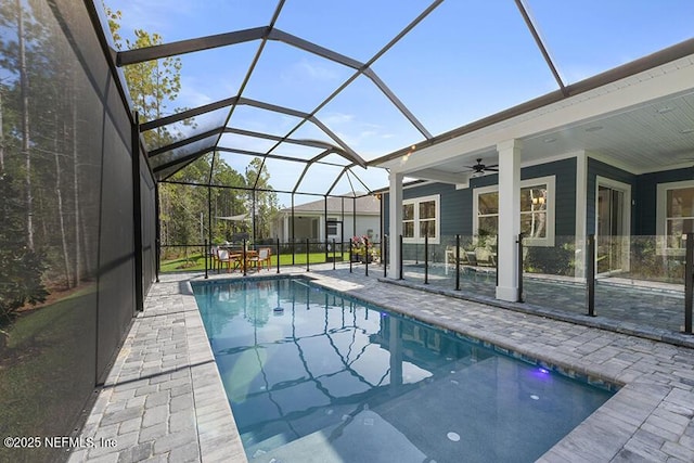 pool featuring a patio area, a lanai, and ceiling fan