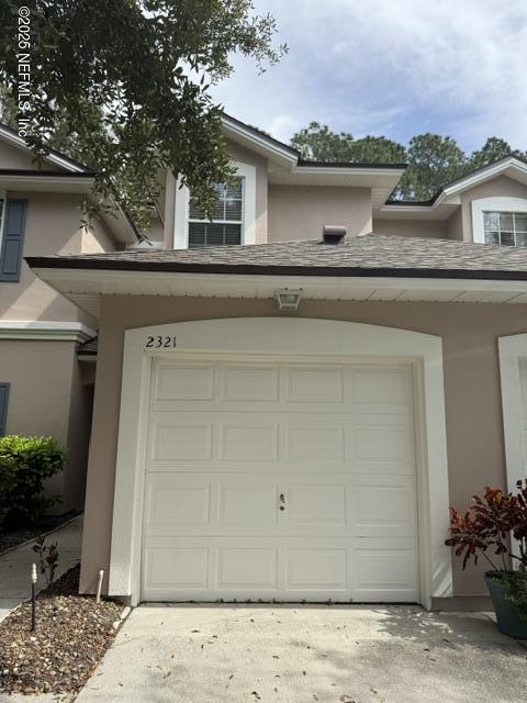 garage featuring driveway