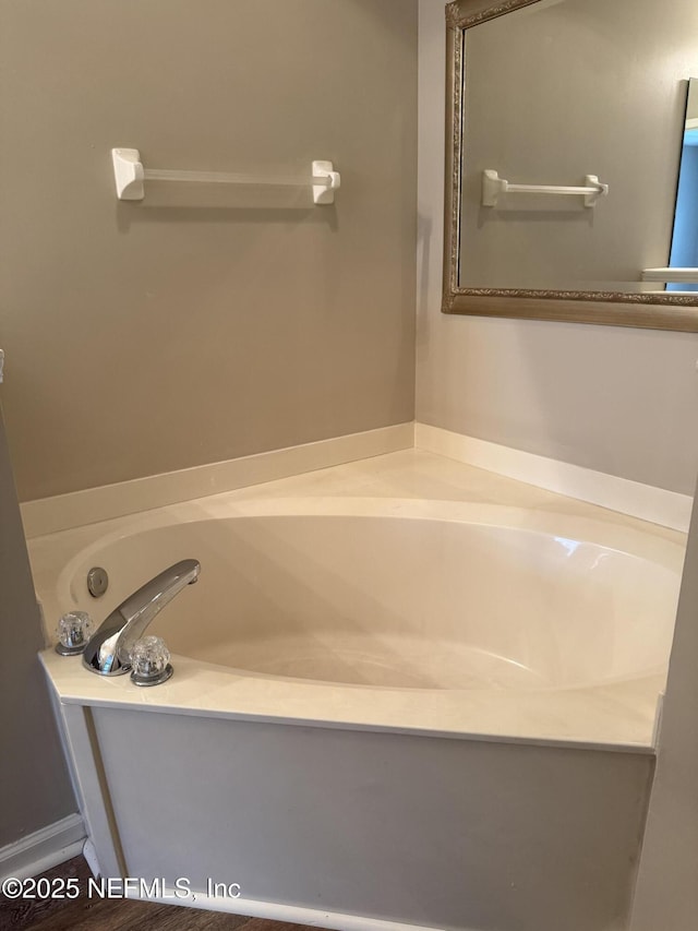 full bathroom featuring a garden tub