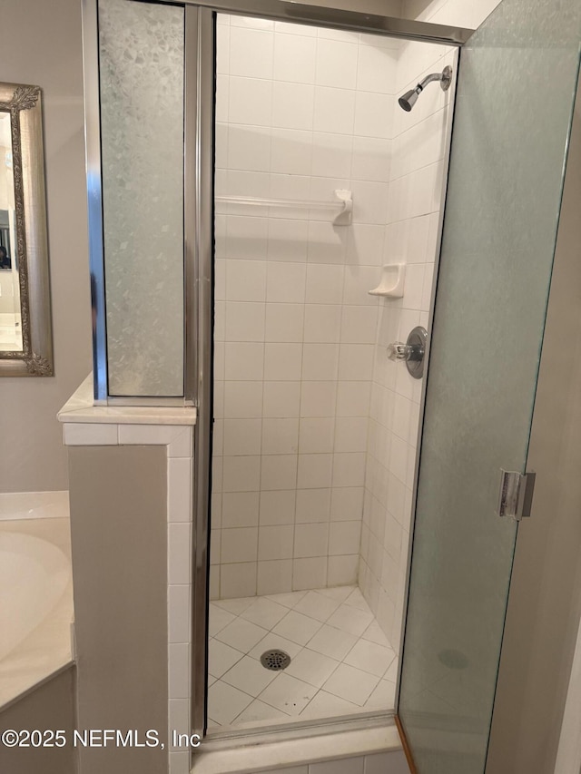 bathroom featuring a shower stall and vanity