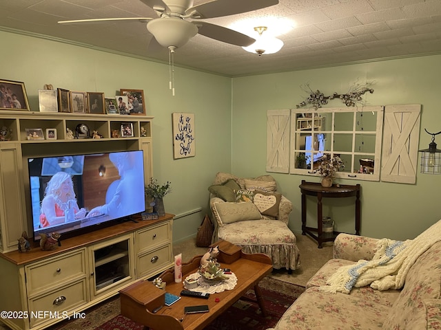 carpeted living room featuring ceiling fan