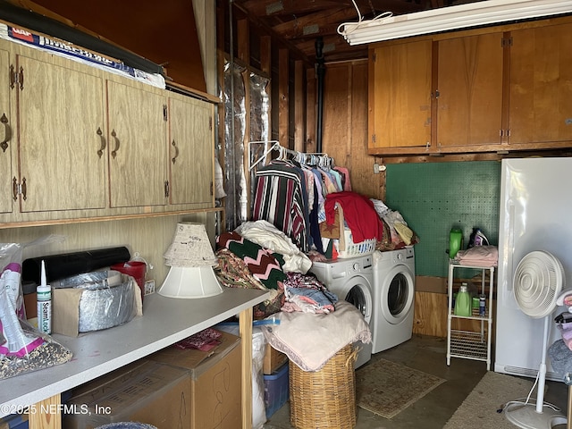 washroom with cabinet space and separate washer and dryer