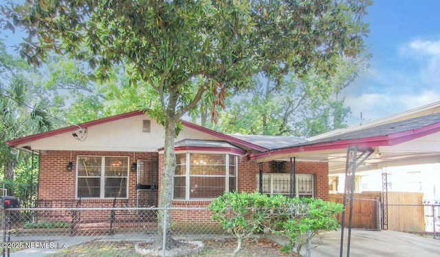 view of front of house with brick siding and a fenced front yard