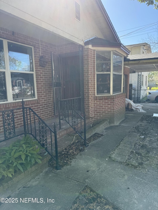 view of home's exterior with brick siding