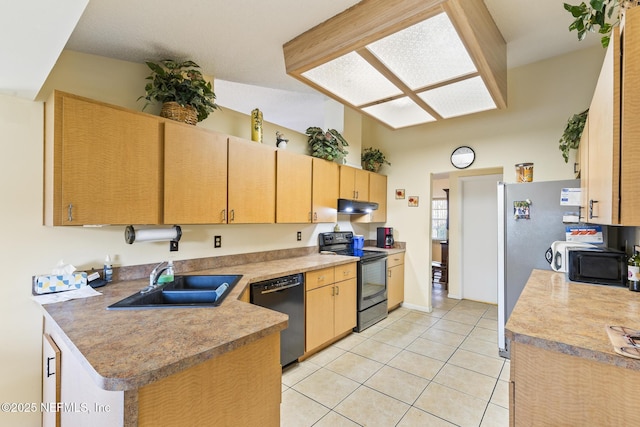 kitchen with light tile patterned floors, light brown cabinetry, a sink, under cabinet range hood, and black appliances