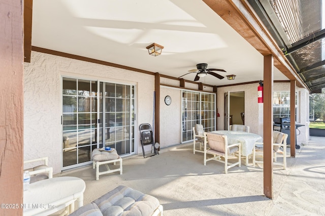 view of patio / terrace with outdoor dining area, a grill, and a ceiling fan