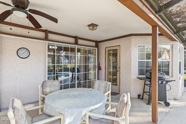 view of patio / terrace with outdoor dining space, grilling area, and a ceiling fan