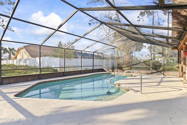 view of swimming pool with a fenced in pool, a lanai, a patio area, and fence