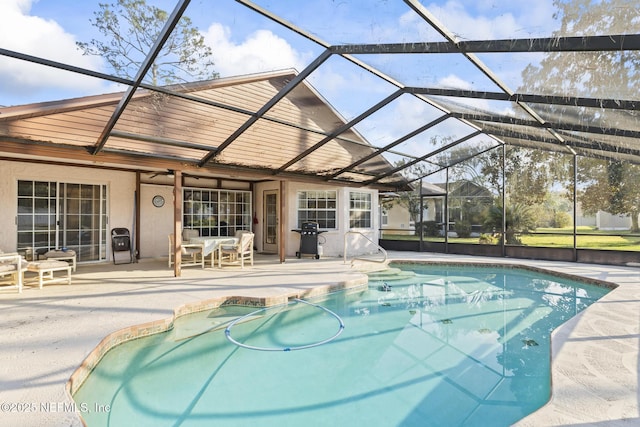 pool featuring area for grilling, a patio area, and a lanai