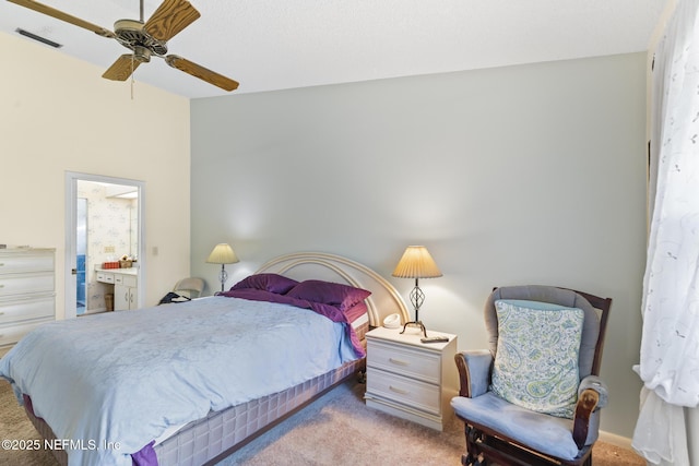 bedroom with visible vents, light carpet, connected bathroom, vaulted ceiling, and ceiling fan