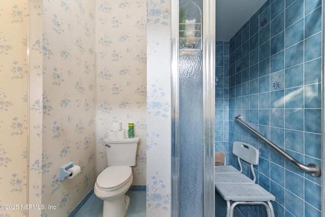 bathroom with toilet and tile patterned flooring