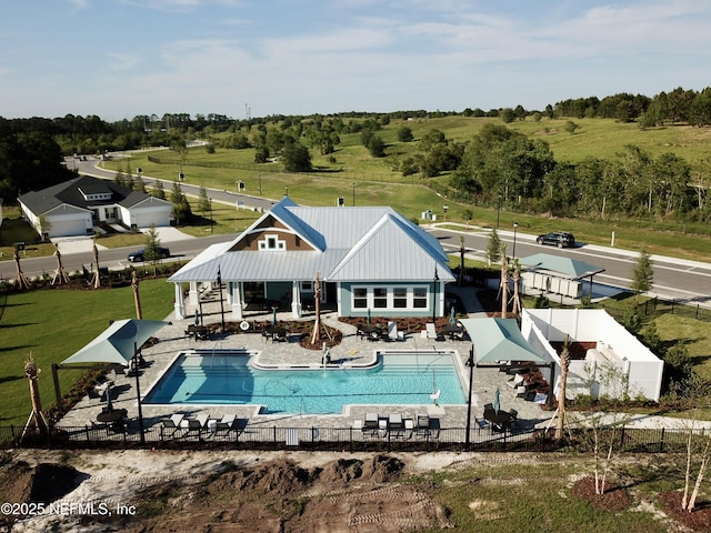 pool featuring a patio and fence