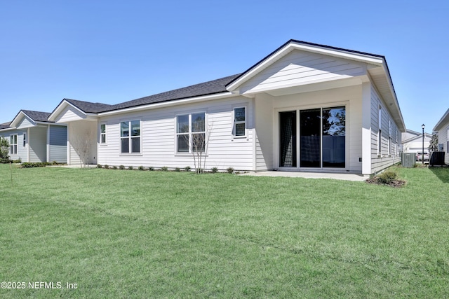4484 Sun Garden Dr, Jacksonville, FL 32257 - back of house with central AC unit and a yard
