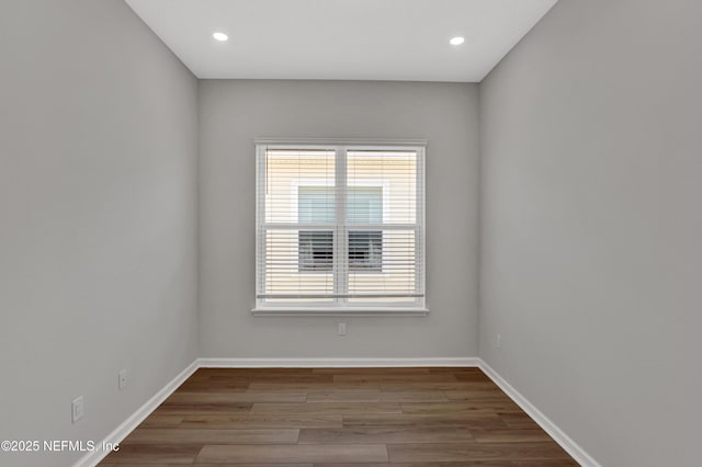 4484 Sun Garden Dr, Jacksonville, FL 32257 - unfurnished room with baseboards, a healthy amount of sunlight, and wood finished floors