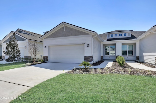 4484 Sun Garden Dr, Jacksonville, FL 32257 - view of front of house featuring a shingled roof, concrete driveway, a front lawn, a garage, and stone siding