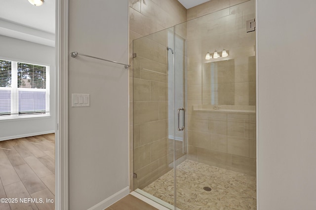 4484 Sun Garden Dr, Jacksonville, FL 32257 - full bathroom with a shower stall, baseboards, and wood finished floors