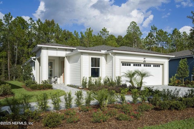 view of front of property with a garage and driveway