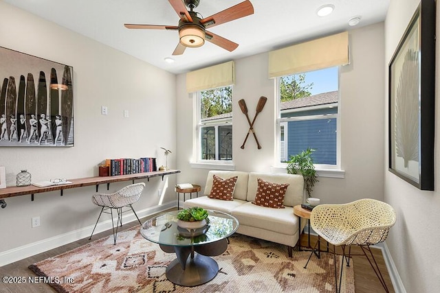 living area with ceiling fan, baseboards, wood finished floors, and recessed lighting