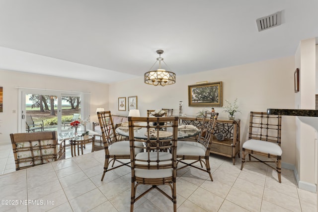 dining space featuring visible vents, baseboards, and light tile patterned flooring