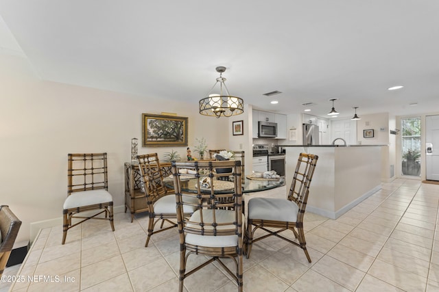 dining area with light tile patterned flooring, recessed lighting, visible vents, and baseboards