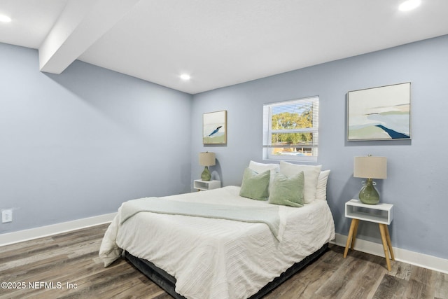 bedroom with recessed lighting, baseboards, and wood finished floors