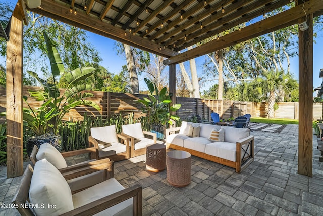 view of patio featuring a fenced backyard and an outdoor living space