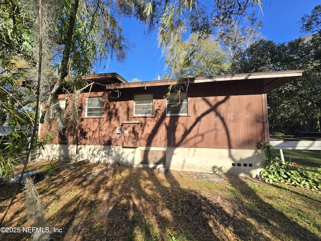 view of home's exterior featuring crawl space