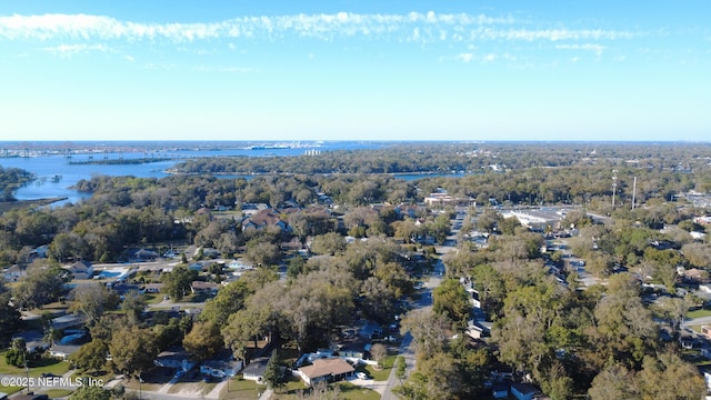 aerial view featuring a water view and a view of trees