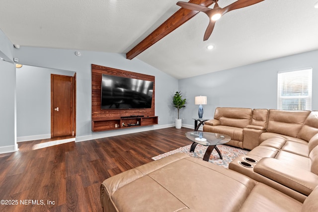 living area featuring vaulted ceiling with beams, a ceiling fan, a textured ceiling, wood finished floors, and baseboards