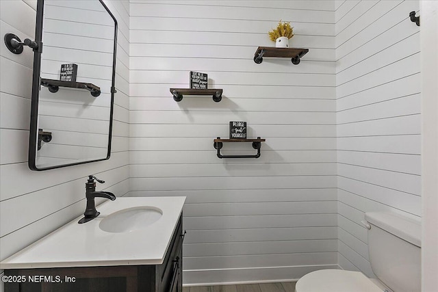 bathroom with vanity and toilet