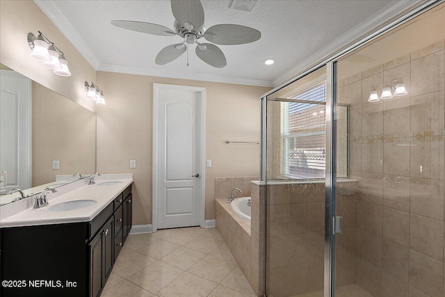 bathroom with a garden tub, ornamental molding, a stall shower, a sink, and tile patterned floors