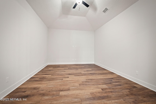 bonus room with vaulted ceiling, wood finished floors, visible vents, and a ceiling fan