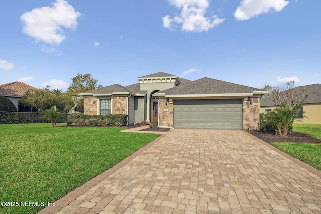 view of front facade with stone siding, roof with shingles, an attached garage, decorative driveway, and a front lawn