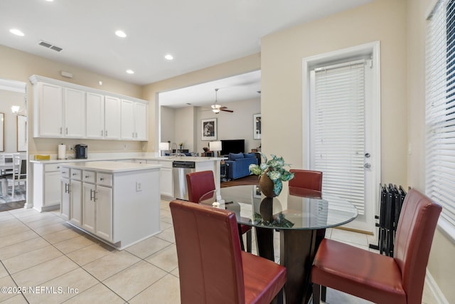 kitchen with ceiling fan, light tile patterned flooring, visible vents, white cabinetry, and dishwasher