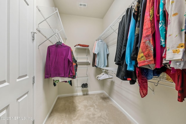 spacious closet with carpet and visible vents