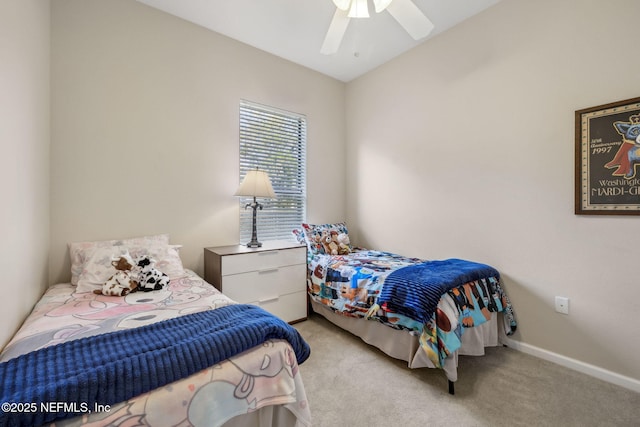 bedroom with light carpet, ceiling fan, and baseboards