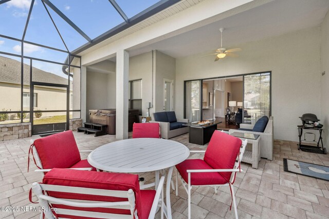 sunroom / solarium with ceiling fan