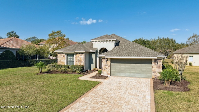 mediterranean / spanish-style house featuring a garage, stone siding, a front lawn, and decorative driveway