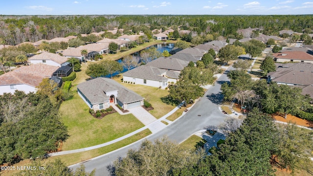 birds eye view of property featuring a residential view and a water view