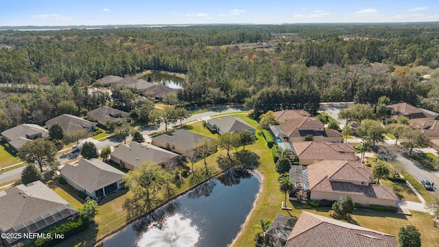 bird's eye view with a residential view, a water view, and a view of trees