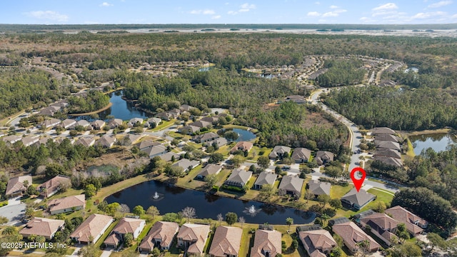 drone / aerial view featuring a water view and a residential view