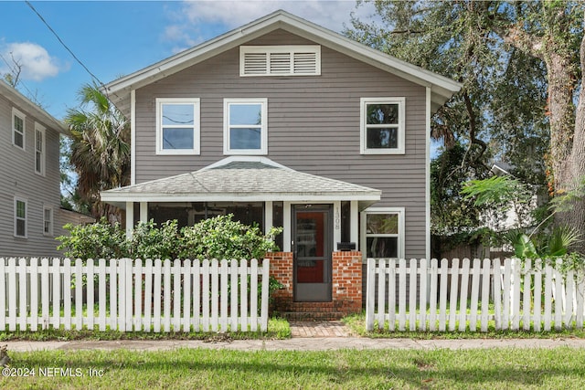 view of front of house featuring fence