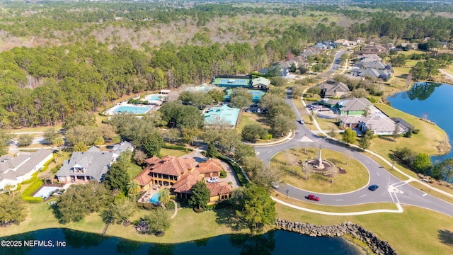 birds eye view of property with a water view, a forest view, and a residential view