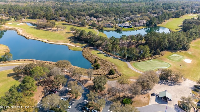 bird's eye view featuring a water view, a view of trees, and golf course view