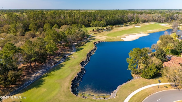 aerial view featuring a water view, a forest view, and golf course view