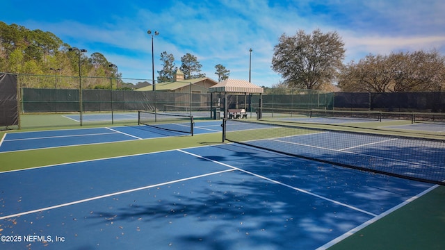 view of sport court with fence